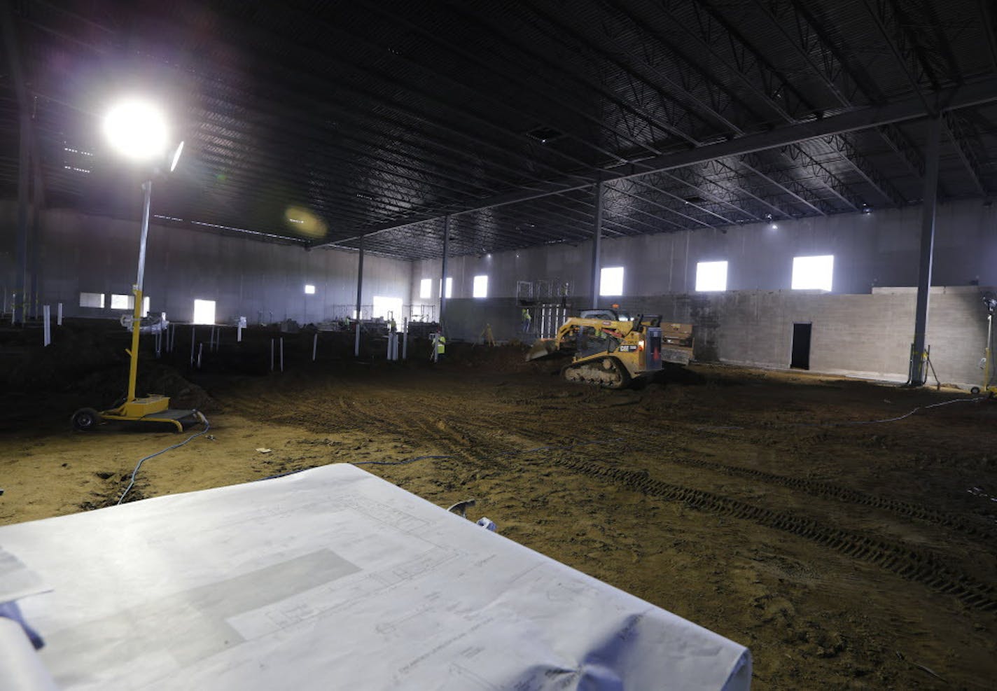 Construction of a corrugated cardboard factory is well under way at the Southeast Industrial Park in Cottage Grove, Minn. Other lots in the area adjacent to the constructions are available for development. ] Shari L. Gross &#xef; shari.gross@startribune.com Long thought of as the red-headed step child of commercial real estate, industrial construction has been booming in the Twin Cities as office and retail has been more stagnant. Hard hat tour of the construction of the Southeast Industrial Par