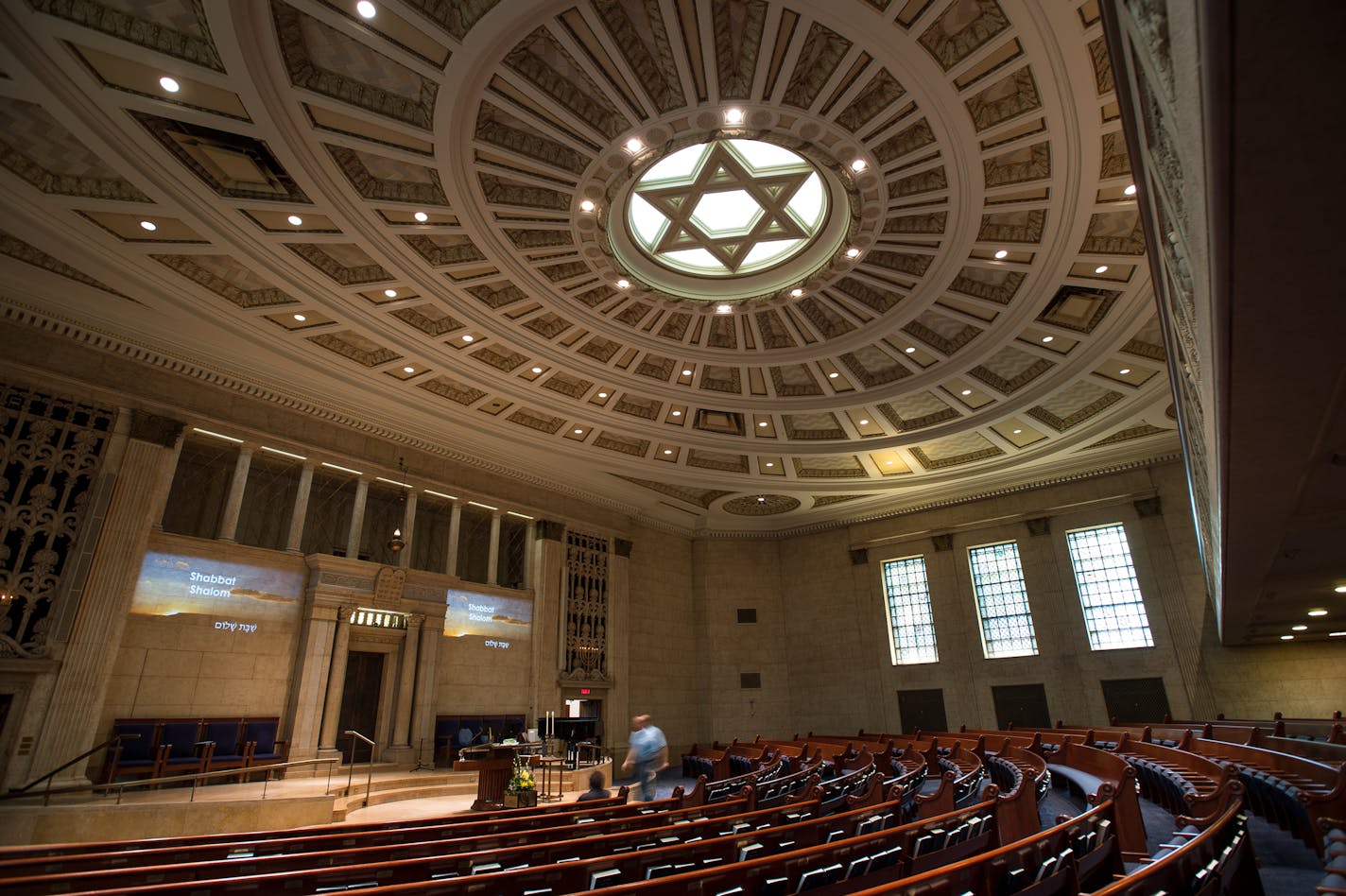 The 1928 building features a unique sanctuary with a dramatic coffered ceiling.