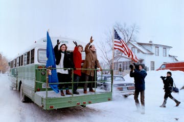 December 30, 1990: Washington or bust Sen.-elect Paul Wellstone, group with his daughter Marcia and wife, Shella, waved farewell from his bus Saturday