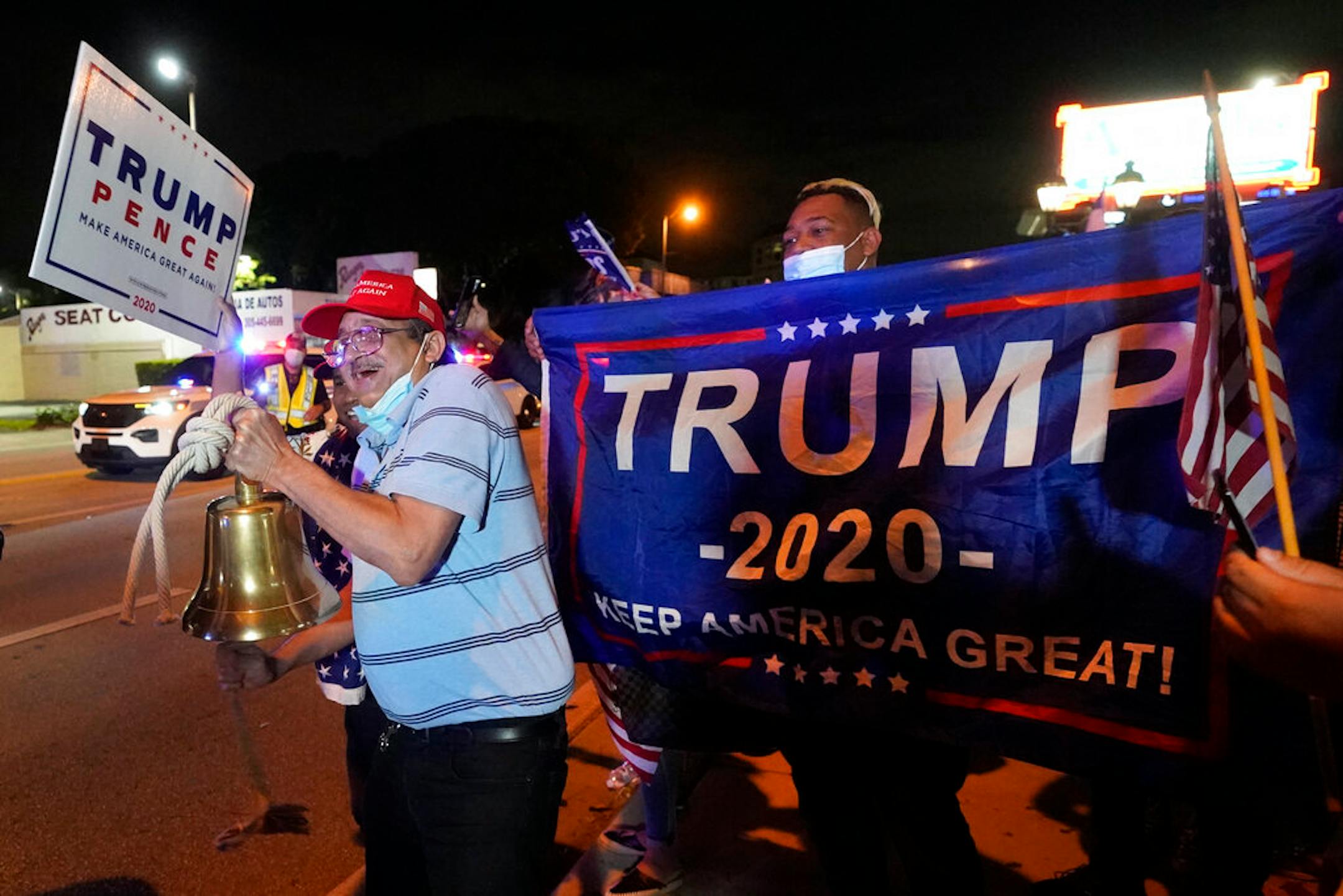 Rafael Fagundo rang a bell as he and other supporters of President Donald Trump chanted and waved flags outside the Versailles Cuban restaurant during a celebration on election night in the Little Havana neighborhood of Miami on Nov. 3.