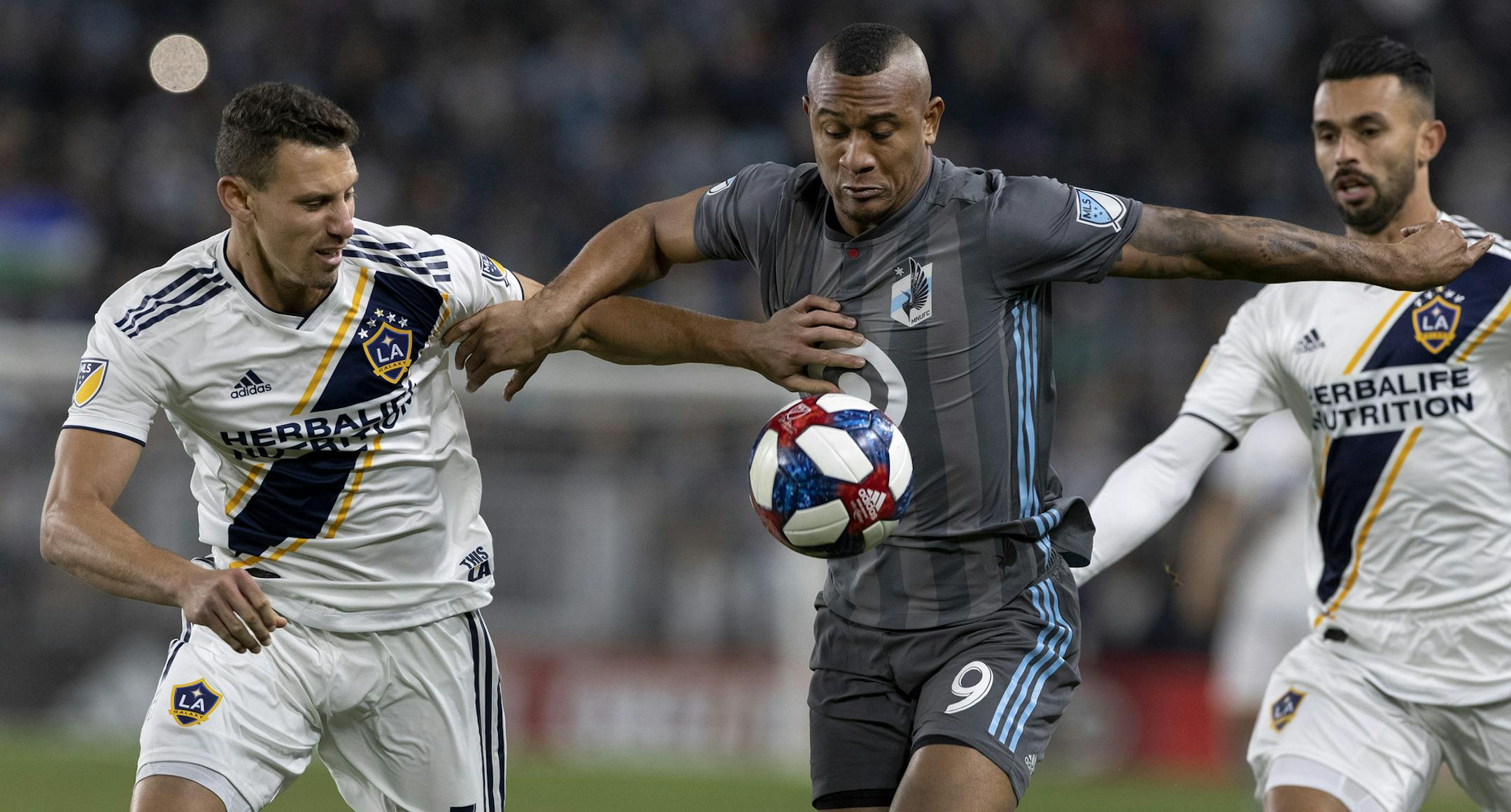 Daniel Steres (5) of the LA Galaxy and Angelo Rodriguez (9) of Minnesota United FC fought for the ball in the first half. ] CARLOS GONZALEZ &#x2022; cgonzalez@startribune.com &#x2013; St. Paul, MN &#x2013; October 20, 2019, Allianz Field, MLS, Soccer, First home playoff game in MLS for Minnesota United FC Loons vs. Los Angeles LA Galaxy