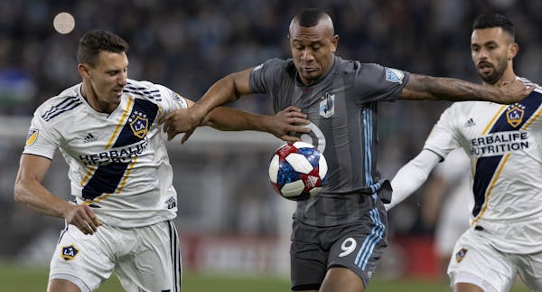 Daniel Steres (5) of the LA Galaxy and Angelo Rodriguez (9) of Minnesota United FC fought for the ball in the first half. ] CARLOS GONZALEZ &#x2022; c