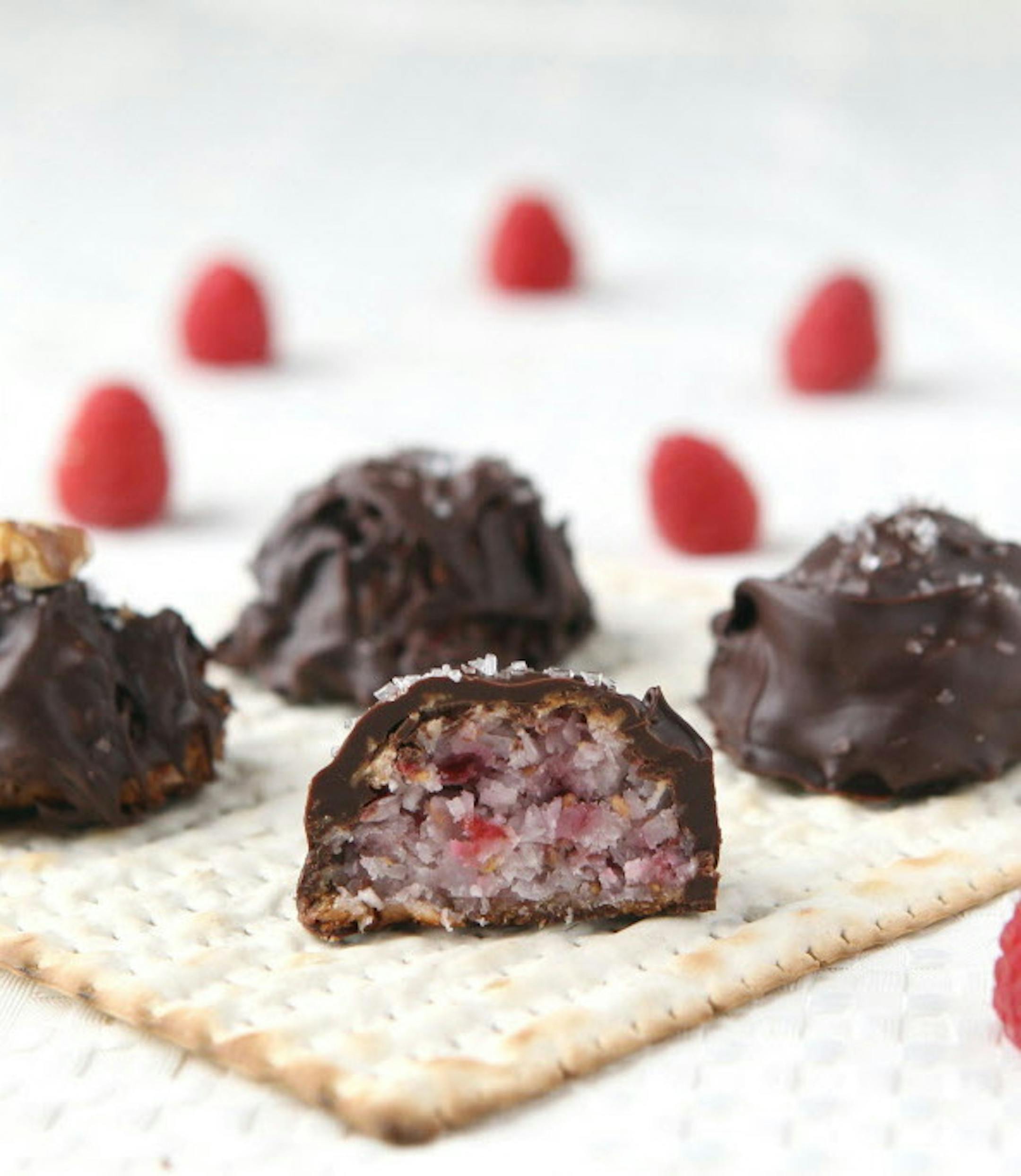 Raspberry macaroons in dipped in chocolate is a modern twist on the traditional Passover dessert. (Hillary Levin/St. Louis Post-Dispatch/TNS) ORG XMIT: 1183327