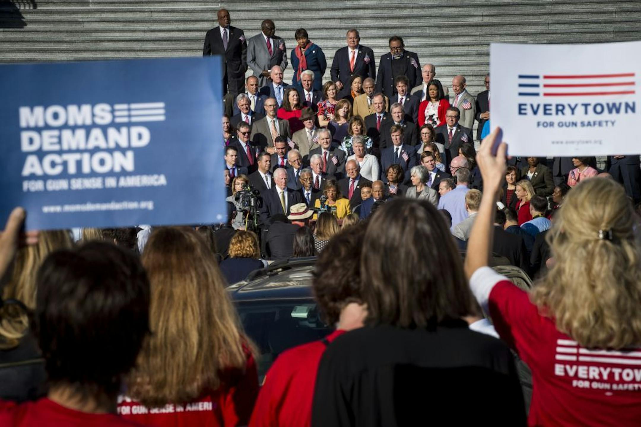 Activists look on from a distance during a rally with congressional Democrats in a call for "common sense" gun violence prevention legislation, on the steps of the U.S. Capitol on Wednesday.