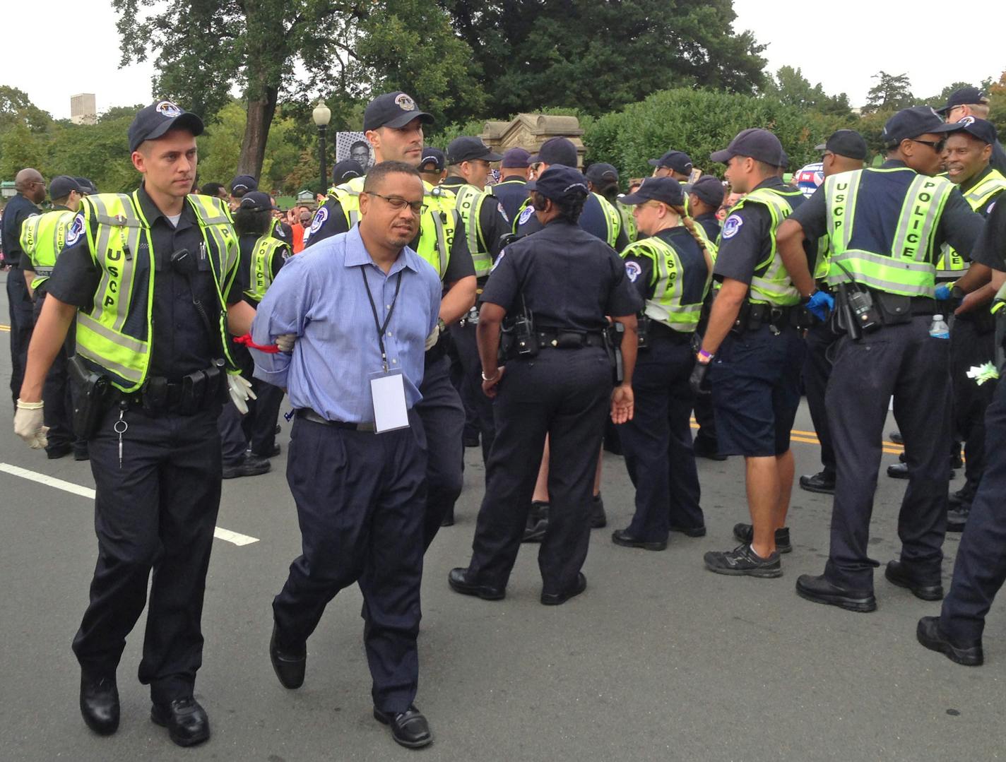 U.S. Rep. Keith Ellison was arrested Tuesday by U.S. Capitol Police during an immigration rally on the National Mall. As protestors marched toward the U.S. Capitol, Ellison and several other House Democrats sat in the middle of Independence Avenue, blocking rush hour traffic. Police led Ellison away in cuffs shortly after 4 p.m. Photo: Kevin Diaz / Star Tribune 10-08-2013 Washington, D.C.