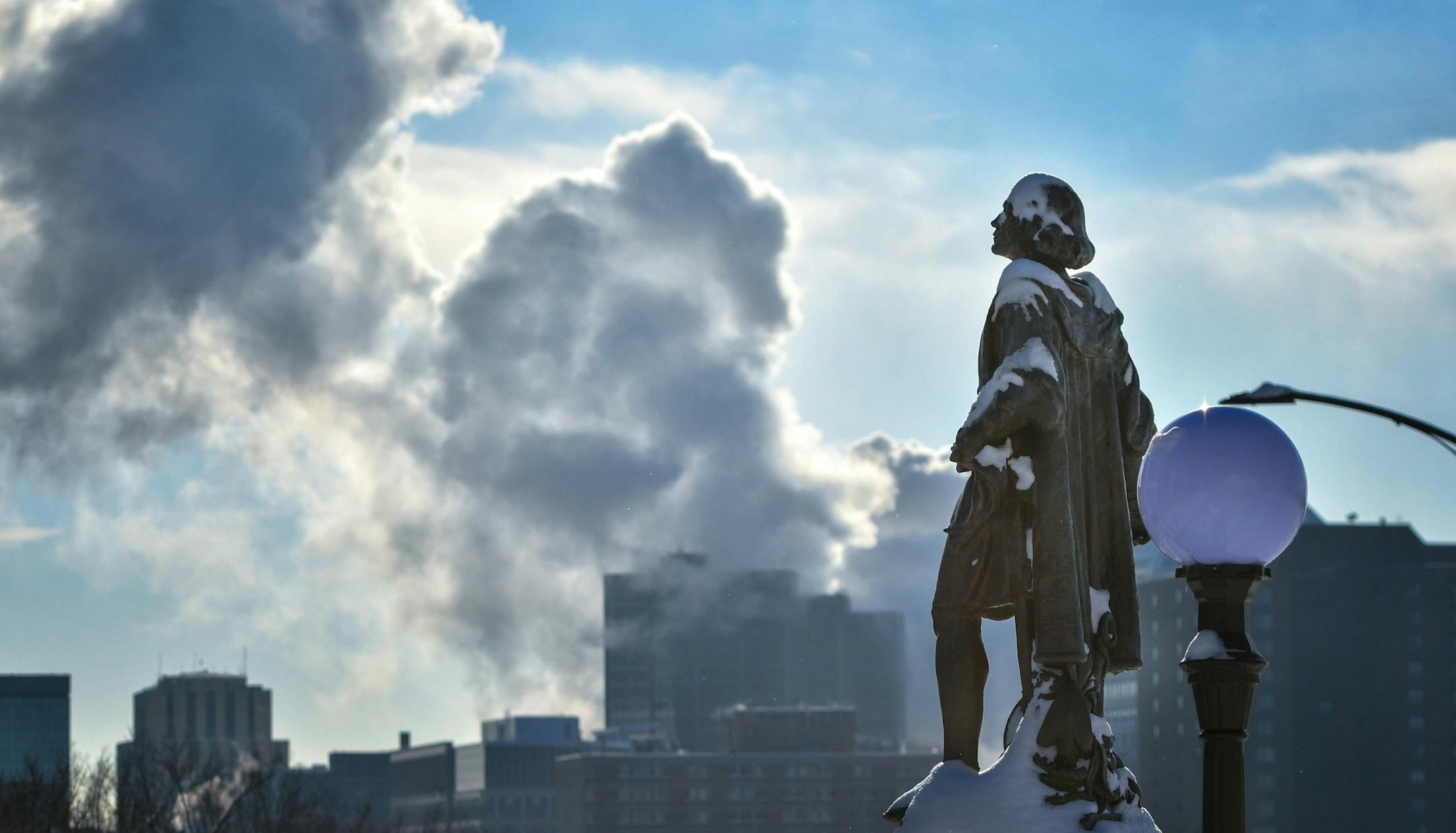 The partially snow-covered Christopher Columbus statue and St. Paul steam plant in single digit temperatures. ] GLEN STUBBE * gstubbe@startribune.com Monday, December 12, 2016 The Twin Cities' coldest weather is arriving. We take a look at just how cold and the looming impact.