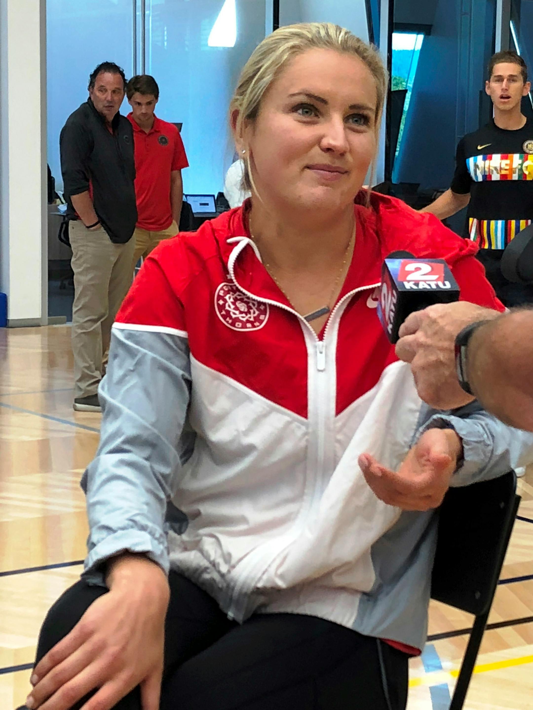 In this photo taken Sept. 20, 2018, Portland Thorns player Lindsey Horan speaks with reporters at a media event for the National Women's Soccer League at Nike in Beaverton, Ore. Horan was named the league's Most Valuable Player. (AP Photo/Anne M. Peterson).