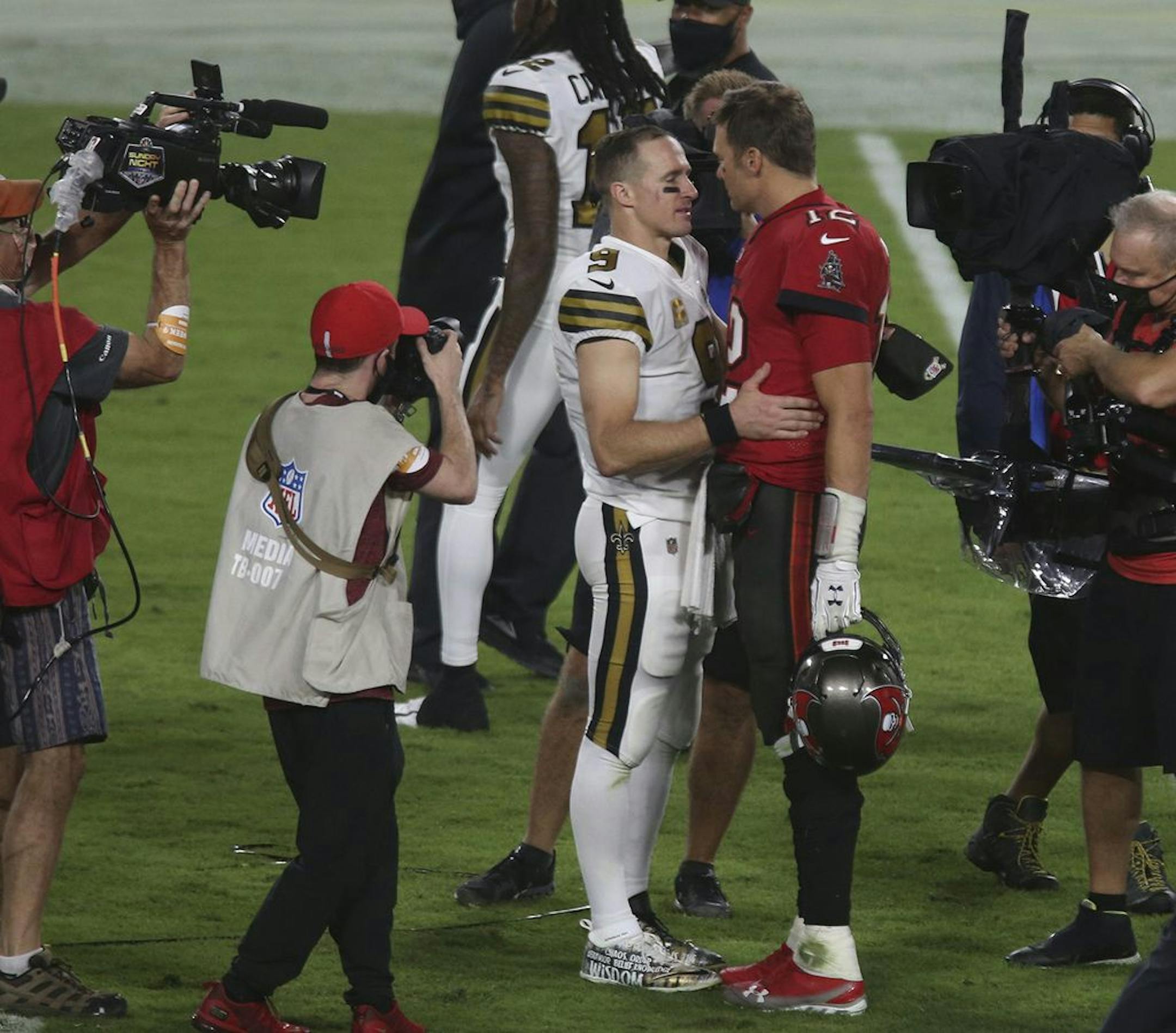 New Orleans Saints quarterback Drew Brees (9) talks with Tampa Bay Buccaneers quarterback Tom Brady (12) after the Buccaneers' loss to the Saints on Sunday, Nov. 8, 2020 at Raymond James Stadium in Tampa, Florida.