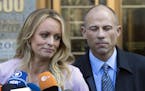 Adult film actress Stormy Daniels with lawyer Michael Avenatti outside federal court, in New York on April 16, 2018.