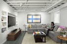 This lower-level makeover of an unfinished basement in Minneapolis has a Finnish theme. It was designed by NewStudio Architecture.