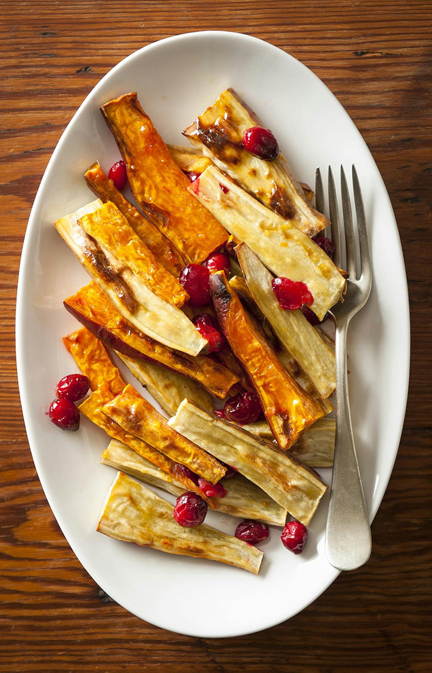 Mette Nielsen, Special to the Star Tribune Thanksgiving side dishes: Cranberry, Orange and Gingered Sweet Potato Wedges