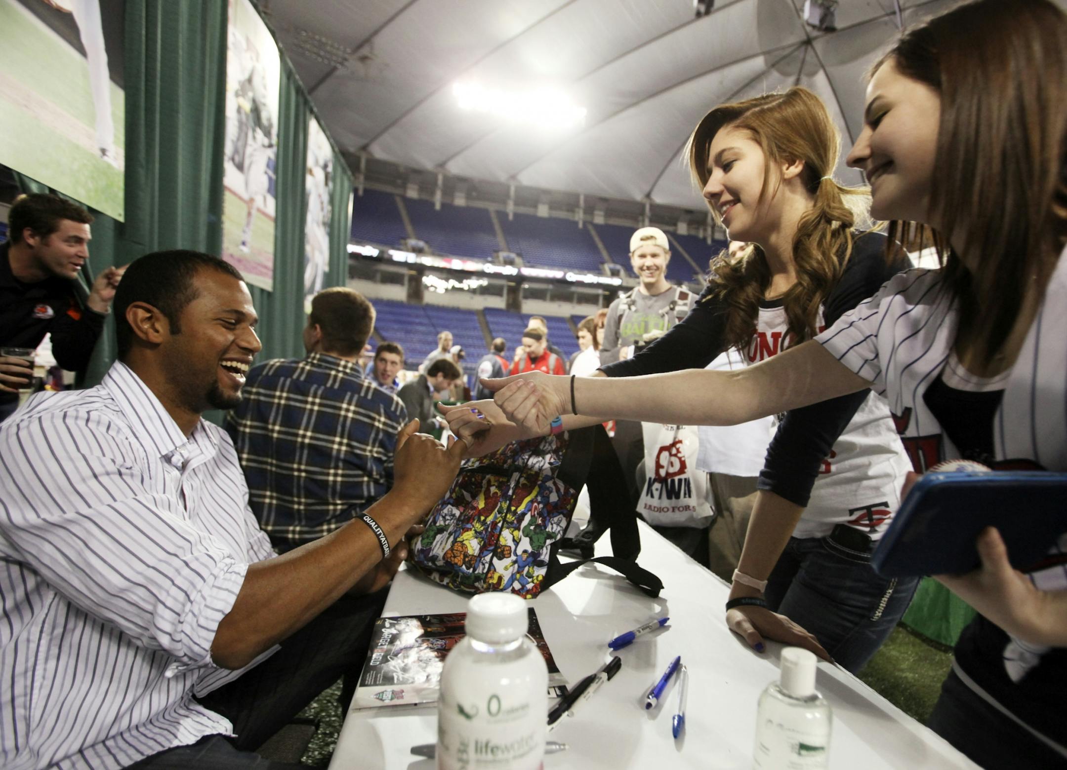 Aaron Hicks signed autographs for fans at TwinsFest in 2012.