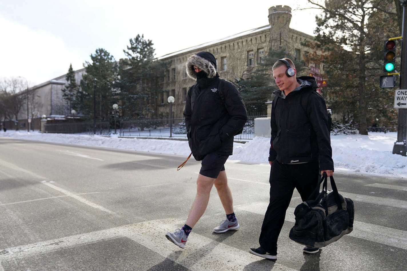 A University of Minnesota student crossed University Avenue in shorts Tuesday, Jan. 29, 2019. He wouldn't give his name because he said his mom would be mad at him.