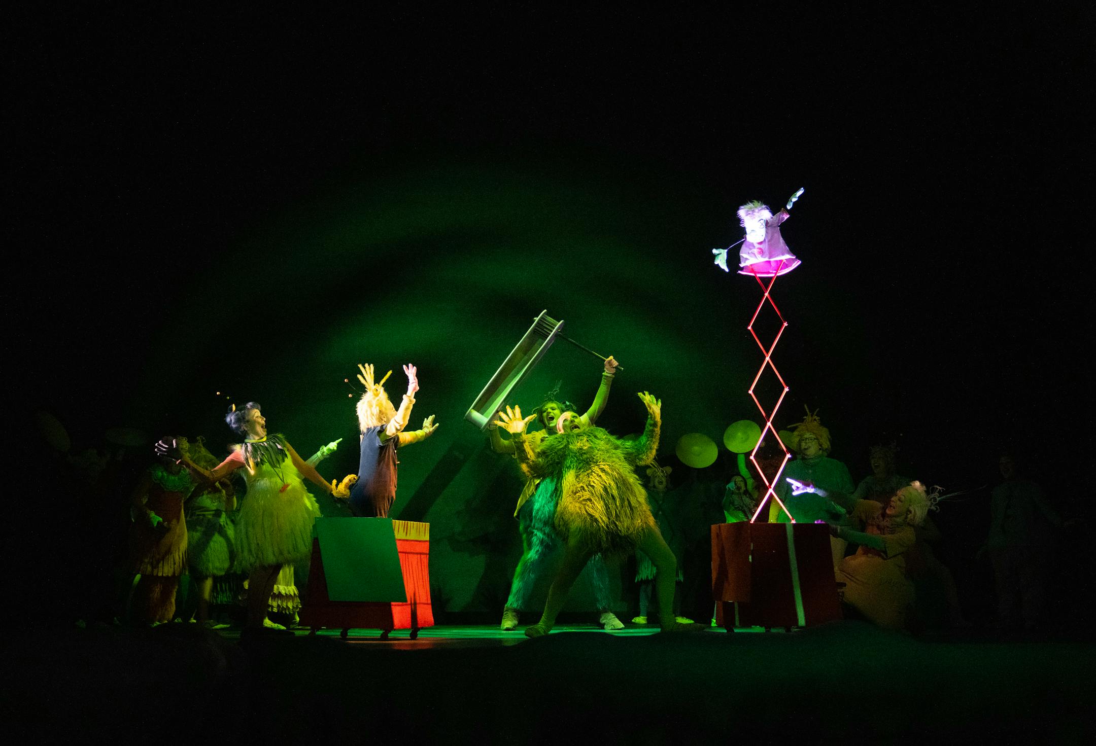 Keegan Robinson, playing the "Grinch double," rehearses on stage Thursday, Nov. 02, 2023, at the Children's Theatre in Minneapolis, Minn. ]