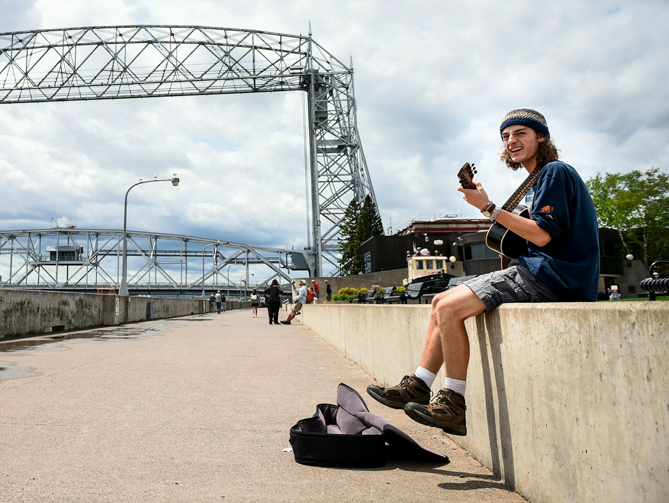 Jacob Mahon, of Duluth, played the acoustic guitar for tips at Duluth's Canal Park Wednesday afternoon.