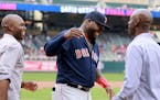 During a pre-game ceremony last season honoring Boston Red Sox and former Minnesota Twin David Ortiz, Ortiz is greeted by former Twins teammates LaTro