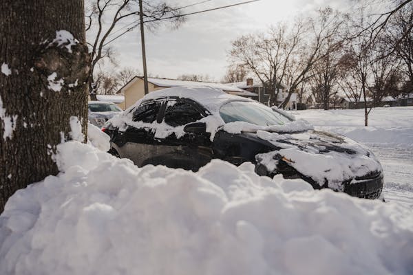 A car was covered in snow last month in St. Paul’s Frogtown neighborhood.