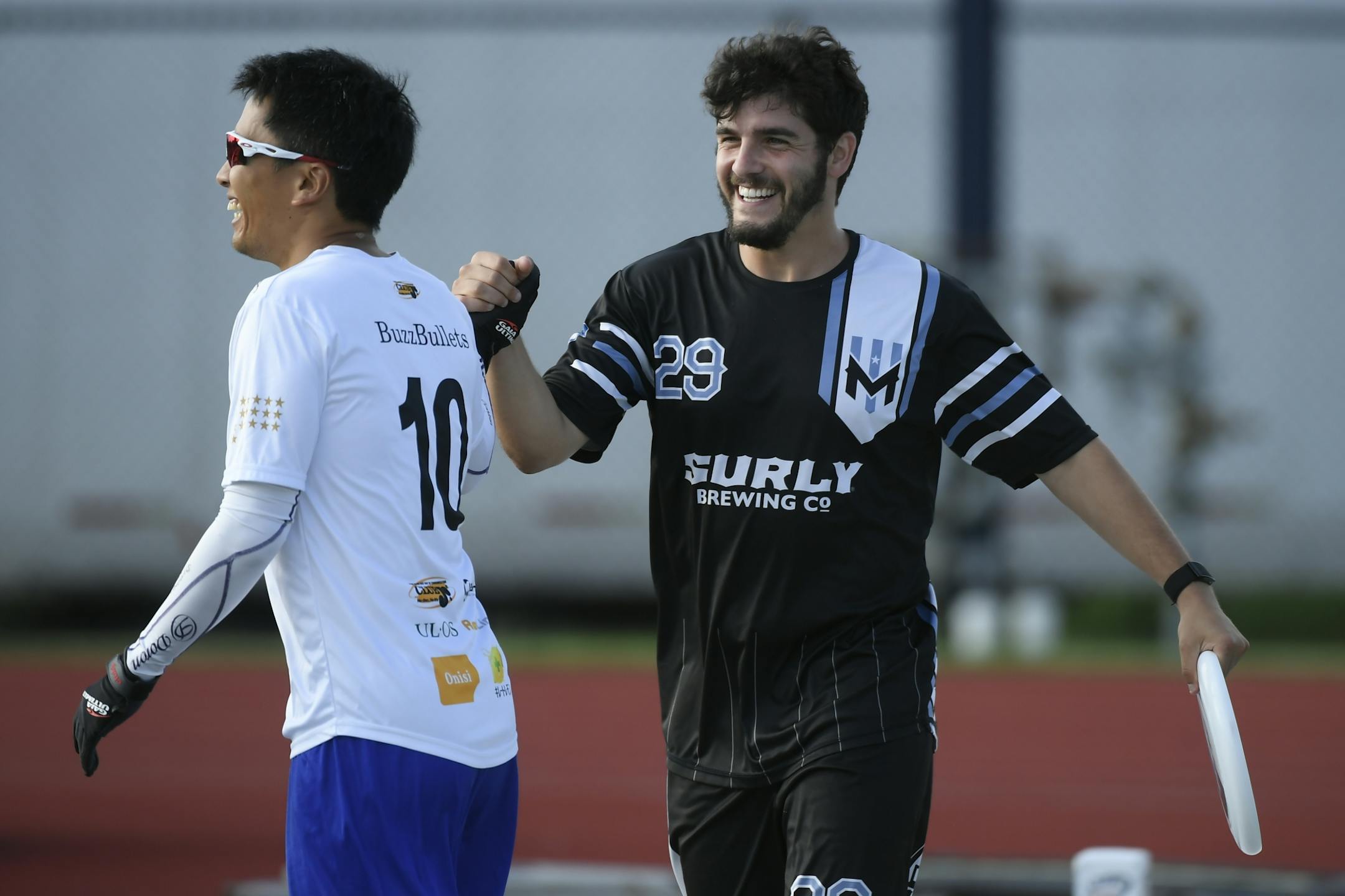 The Minnesota Wind Chill's Josh Klane high fived the Buzz Bullets' Masahiro Matsuno after Klane scored a point against the team from Japan Wednesday night.