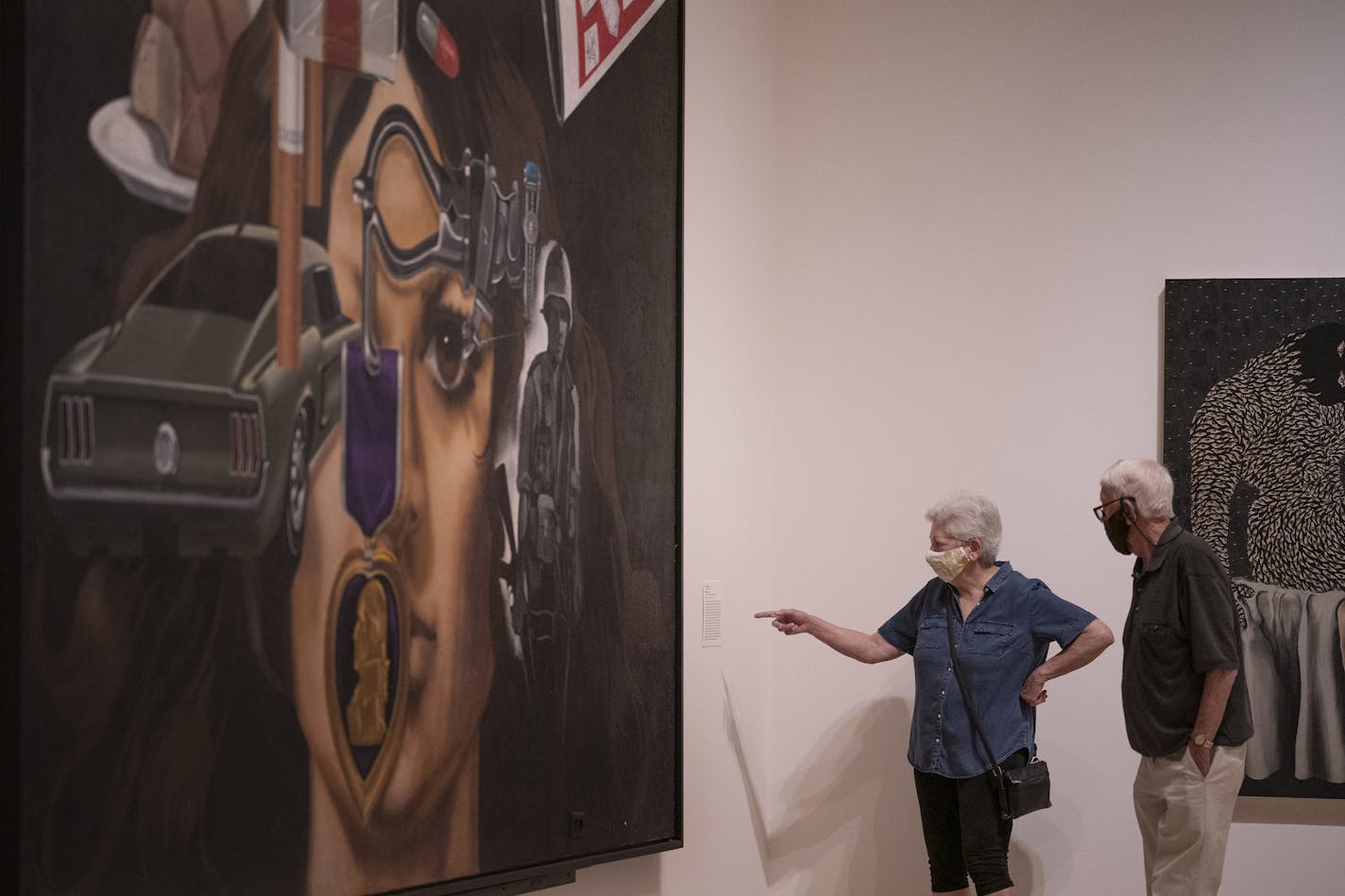 John and Claudia Madison of St. Louis Park examined "Mi Vida" by Jesse Trevino during Thursday's reopening day at the Minneapolis Institute of Art.