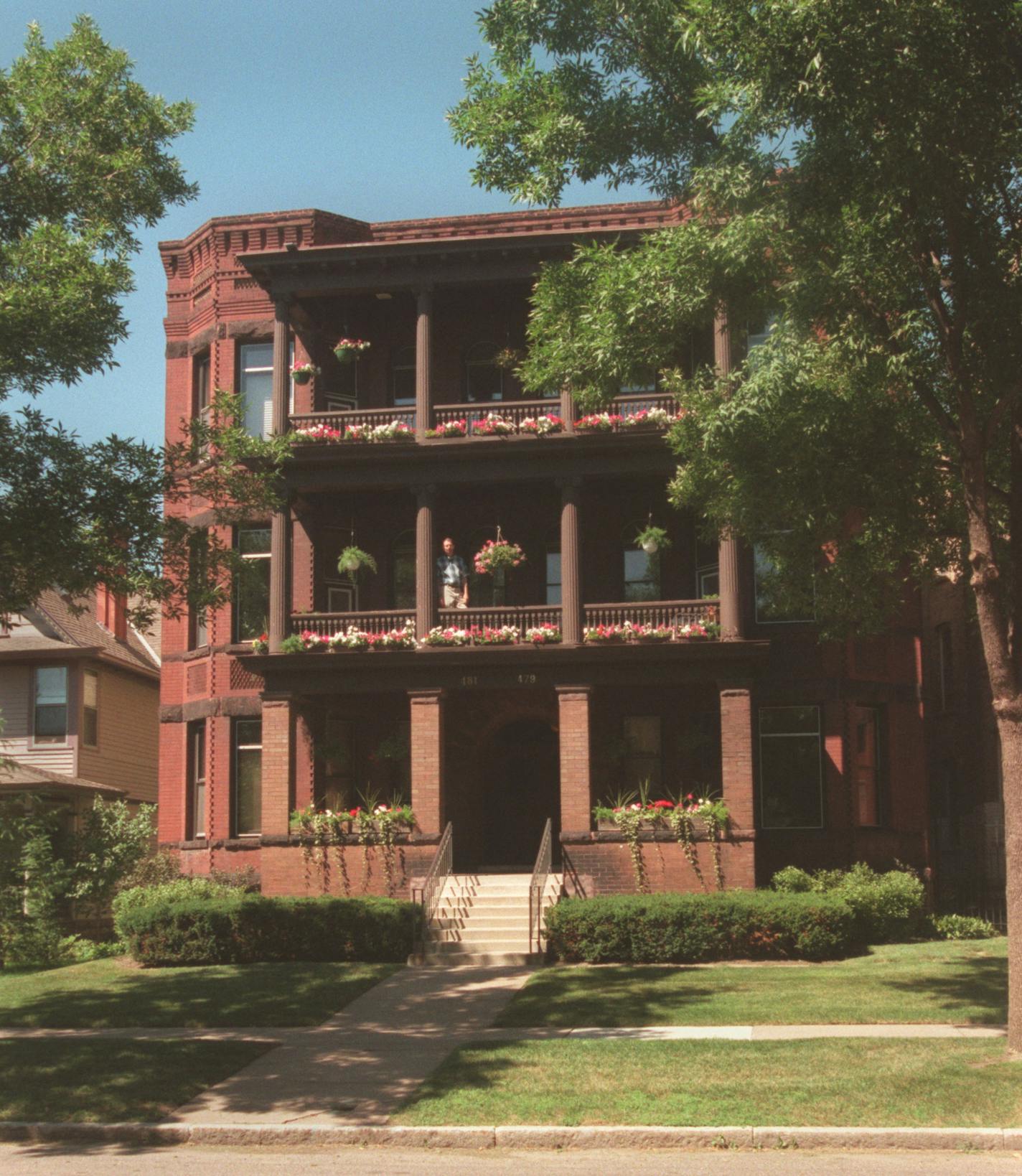 F. Scott Fitzgerald landmarks -- F. Scott Fitzgerald's birthplace--481 Laurel Av., St. Paul. The current resident, Richard McDermott, is standing on the balcony of the second floor apartment where F. Scott Fitzgerald was born.