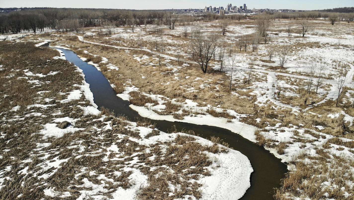 Battle Creek flows through the site with St. Paul in the background. Barrels of toxic waste and leaking batteries once dotted the landscape around Pig's Eye Lake, which is the largest dump left from the days before regulated landfills. Cleaning up the Superfund site has been a slow process, but regulators are now leaning on the Met Council to address soils believed to be contaminated with metals from incinerated wastewater sludge. The Met Council is pushing back, saying it's not their responsibi