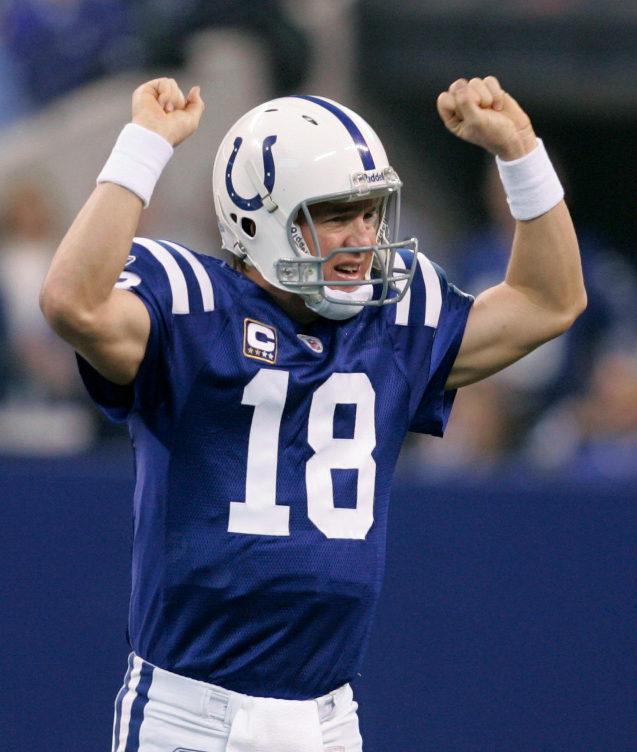 Indianapolis Colts quarterback Peyton Manning reacts after a score during the third quarter of an NFL football game against the Cincinnati Bengals in Indianapolis, Sunday, Dec. 7, 2008. The Colts won 35-3.