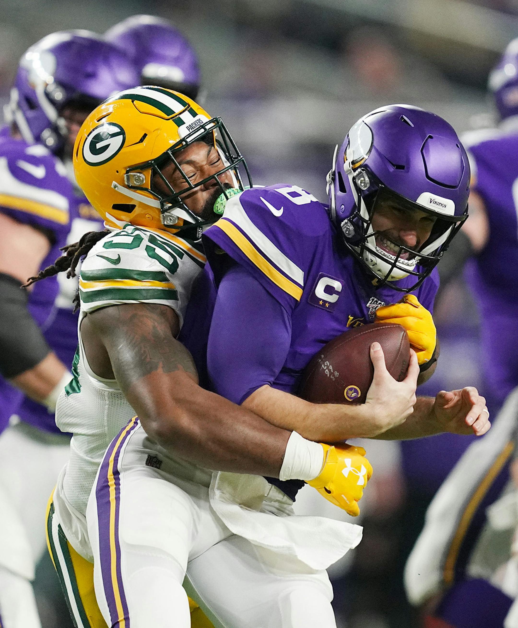 Minnesota Vikings quarterback Kirk Cousins (8) is sacked by Green Bay Packers outside linebacker Za'Darius Smith (55) in the second quarter Monday, Dec. 23, 2019 at U.S. Bank Stadium in Minneapolis, Minn. (Anthony Souffle/Minneapolis Star Tribune/TNS) ORG XMIT: 1524148