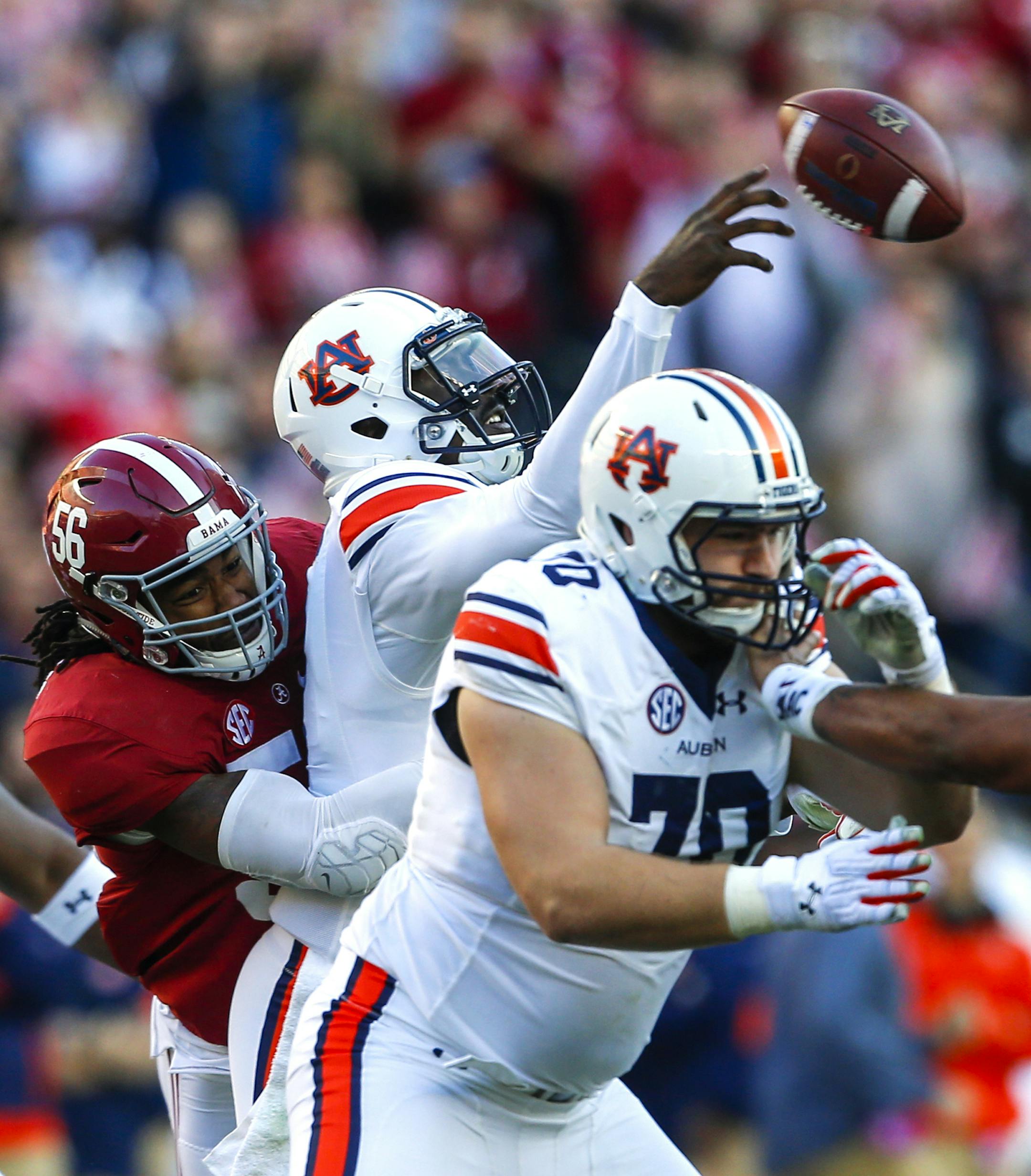 Alabama linebacker Tim Williams (56) hits Auburn quarterback Jeremy Johnson (6) causing an incomplete pass during the first half of the Iron Bowl NCAA college football game, Saturday, Nov. 26, 2016, in Tuscaloosa, Ala. (AP Photo/Butch Dill)