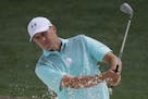 Jordan Spieth hits from a bunker on the 18th hole during a practice round for the Masters golf tournament Wednesday, April 4, 2018, in Augusta, Ga. (A