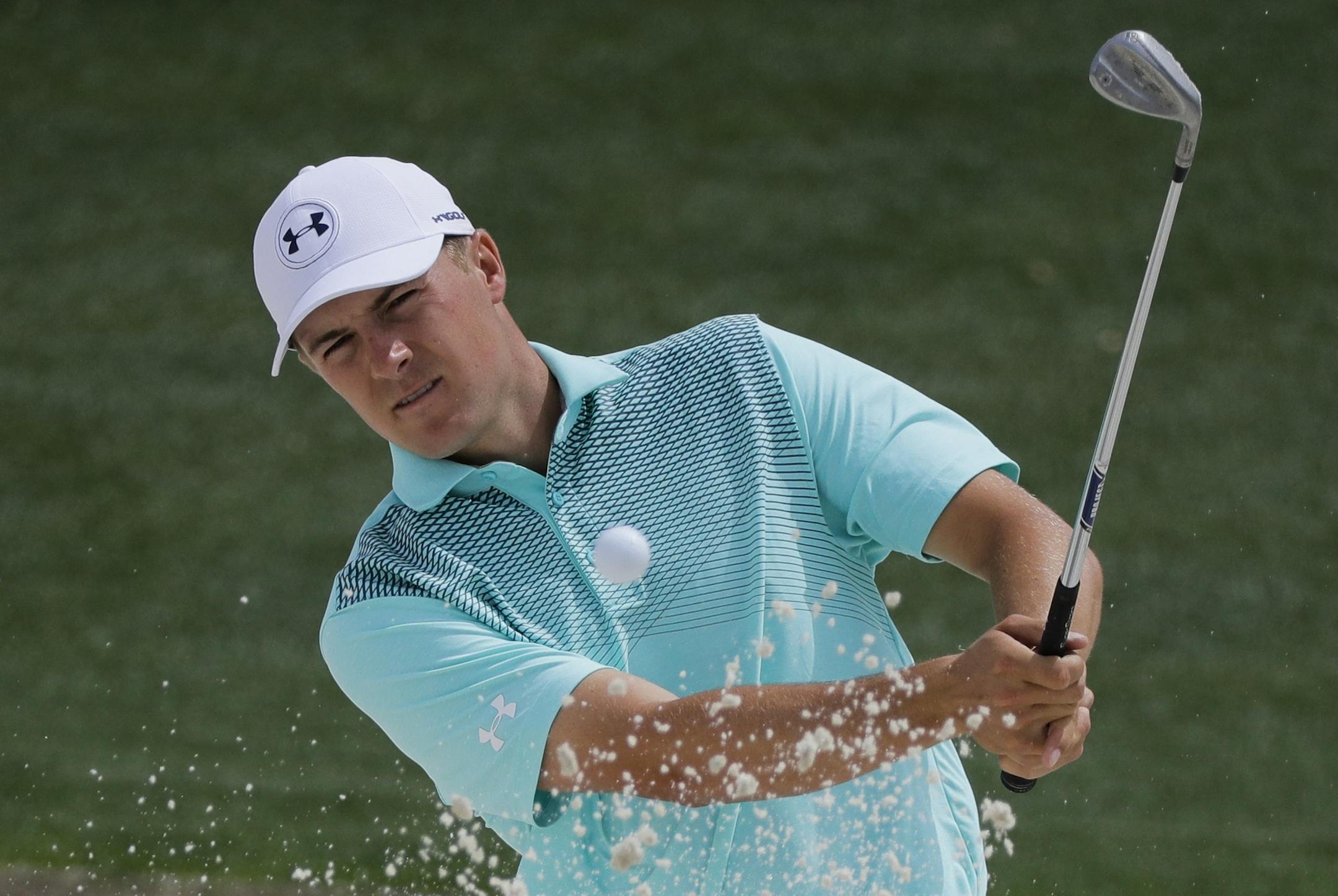 Jordan Spieth hits from a bunker on the 18th hole during a practice round for the Masters golf tournament Wednesday, April 4, 2018, in Augusta, Ga. (AP Photo/David J. Phillip)