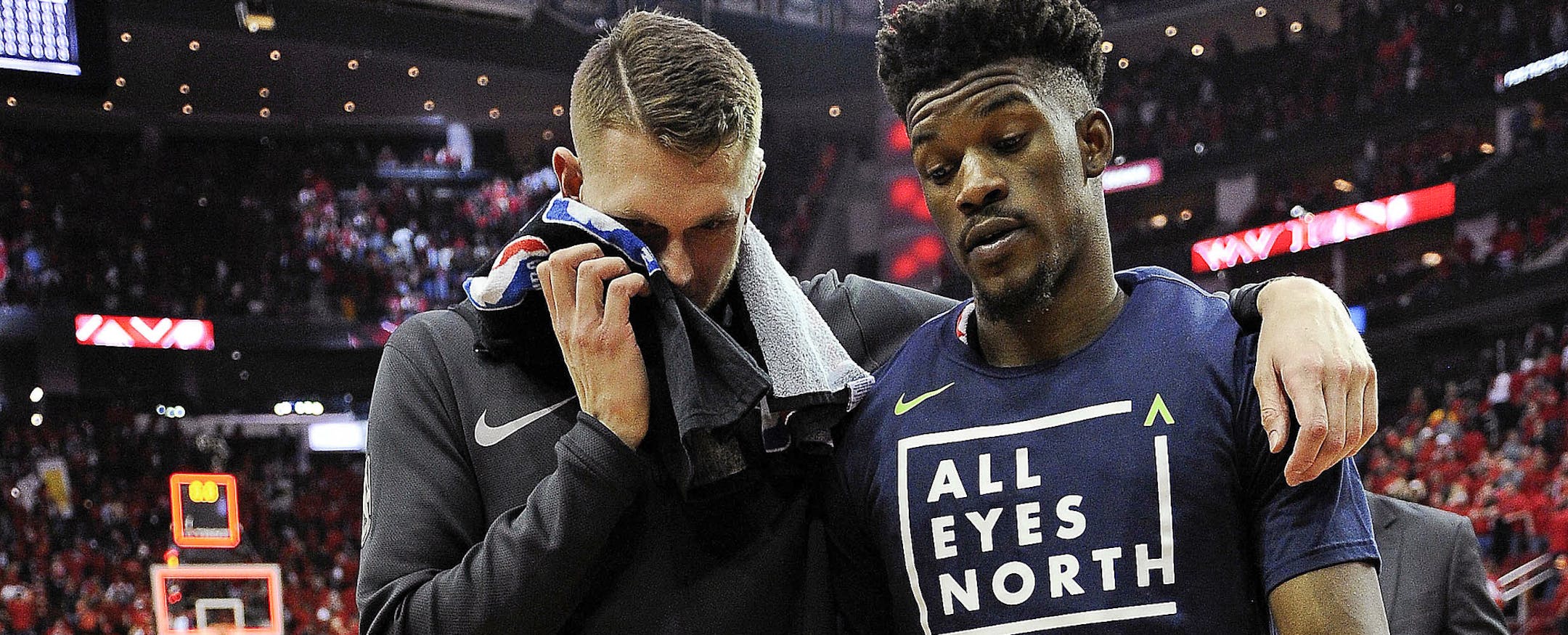 Minnesota Timberwolves' Jimmy Butler, right, and Cole Aldrich walk off the court after the team's 122-104 loss to the Houston Rockets in Game 5 of a first-round NBA basketball playoff series Wednesday, April 25, 2018, in Houston. (AP Photo/Eric Christian Smith) ORG XMIT: MIN2018042523290486