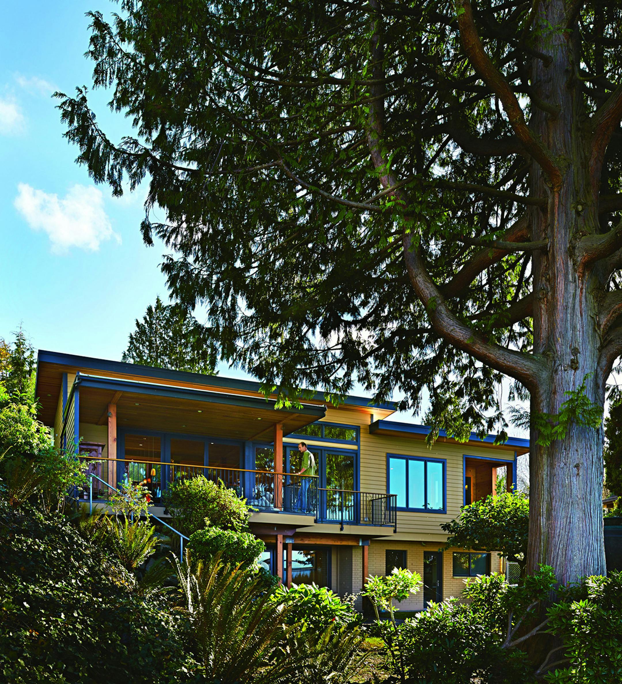 Tour the house that Craigslist built. The rafters in the old house are exterior studs now. The sliding doors are Sierra Pacific. "They were the cheapest, to be honest," Henderson says. The family has the big view they so desired, northwest to: Edmonds, Bainbridge Island, Carkeek Beach, Whidbey Island, Mount Constance and The Brothers. (Benjamin Benschneider/Seattle Times/MCT)