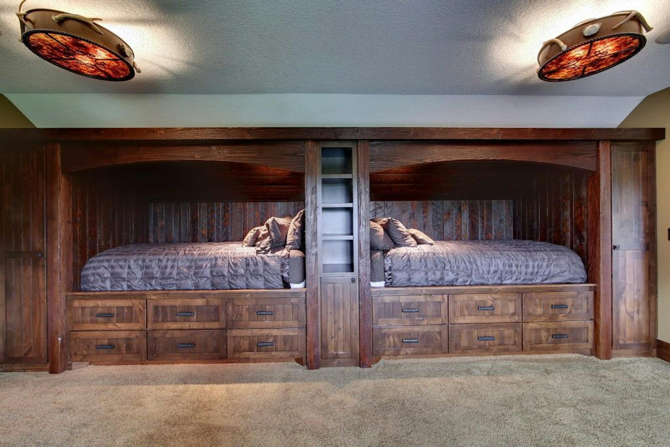The sleeping loft has built-in bunkhouse-style beds.