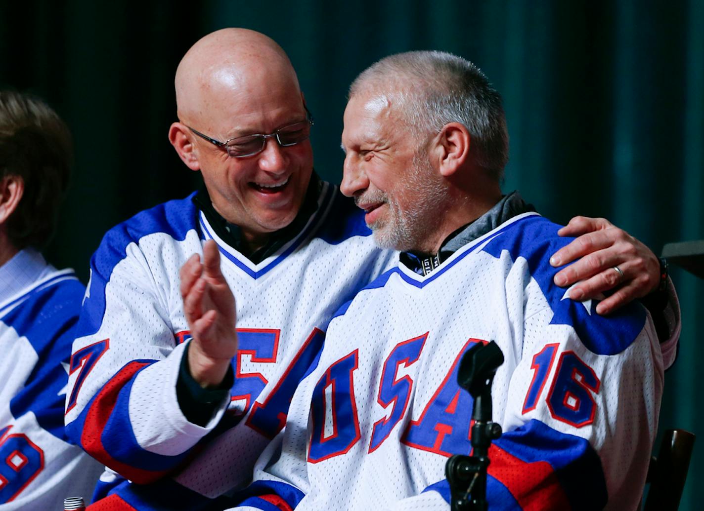 FILE - In this Feb. 21, 2015, file photo, Jack O'Callahan, left, and Mark Pavelich of the 1980 U.S. ice hockey team talk during a "Relive the Miracle" reunion at Herb Brooks Arena in Lake Placid, N.Y. Pavelich has died at a treatment center for mental illness. Officials in Anoka County, Minnesota, confirmed Friday, March 5, 2021, that Pavelich, 63, died at the Eagle's Healing Nest in Sauk Centre, Minn., Thursday morning. The cause and manner of death are still pending. (AP Photo/Mike Groll, File)