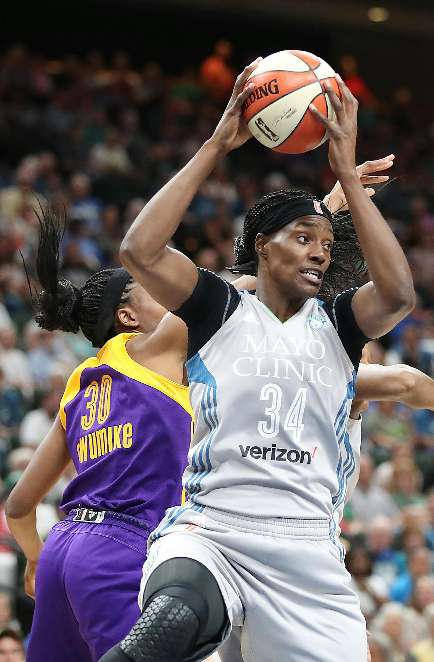 Lynx center Sylvia Fowles and Sparks forward Nneka Ogwumike battled for possession under the net during the first quarter as the Minnesota Lynx took on the L.A. Sparks at the Xcel Energy Center, Thursday, July 6, 2017 in St. Paul, MN. ] ELIZABETH FLORES &#xef; liz.flores@startribune.com