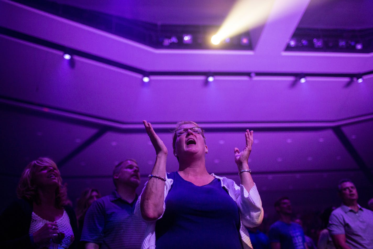 Rachel Hedberg participates in worship songs at Eagle Brook Church in Lino Lakes. Hedberg said she's been coming to the church for 7½ years. NICOLE NERI • nicole.neri@startribune.com