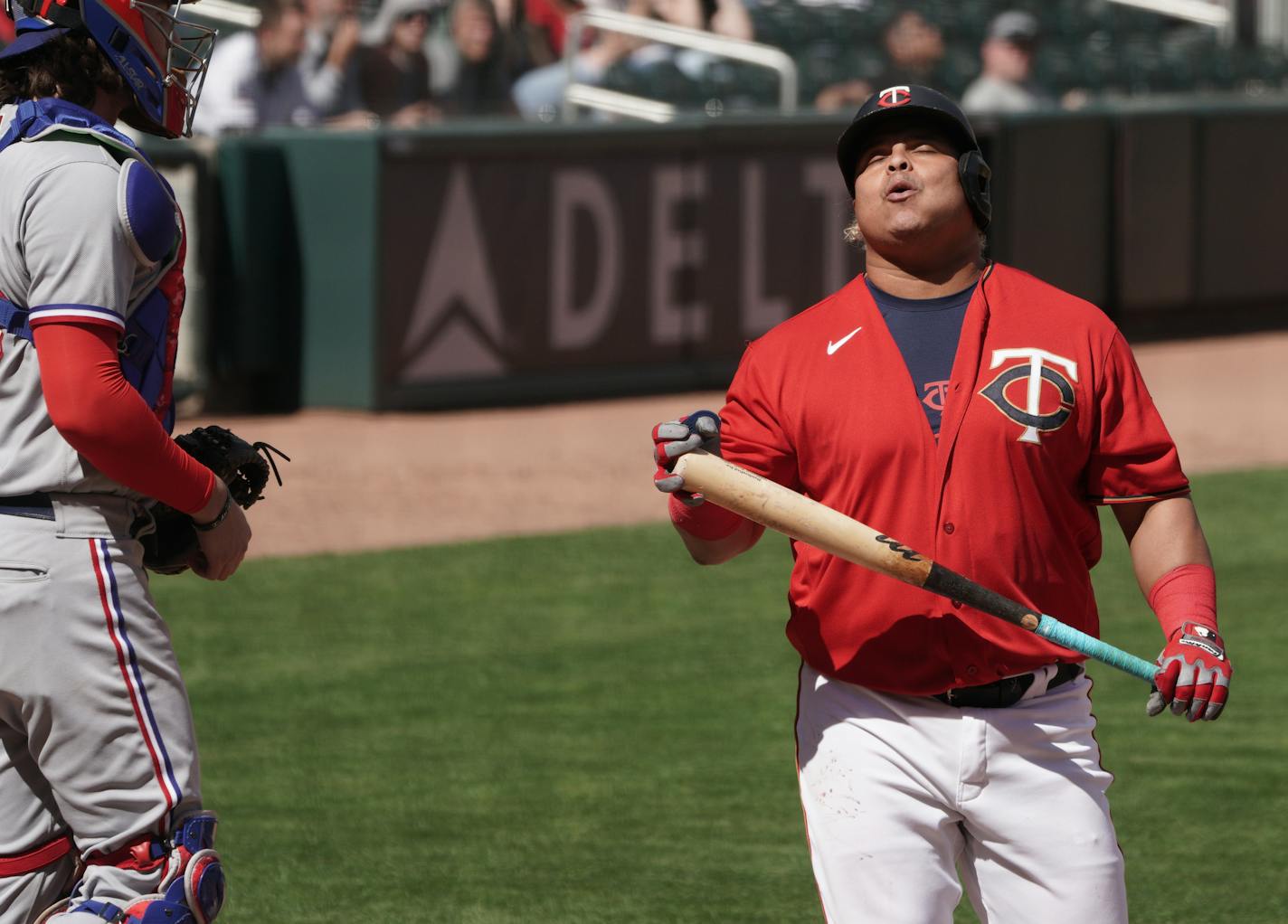 Twins couldn't find the bats when they needed them most, Willians Astudillo reacts after striking out in the 10th inning. ] Texas Rangers at Minnesota Twins, Target Field.