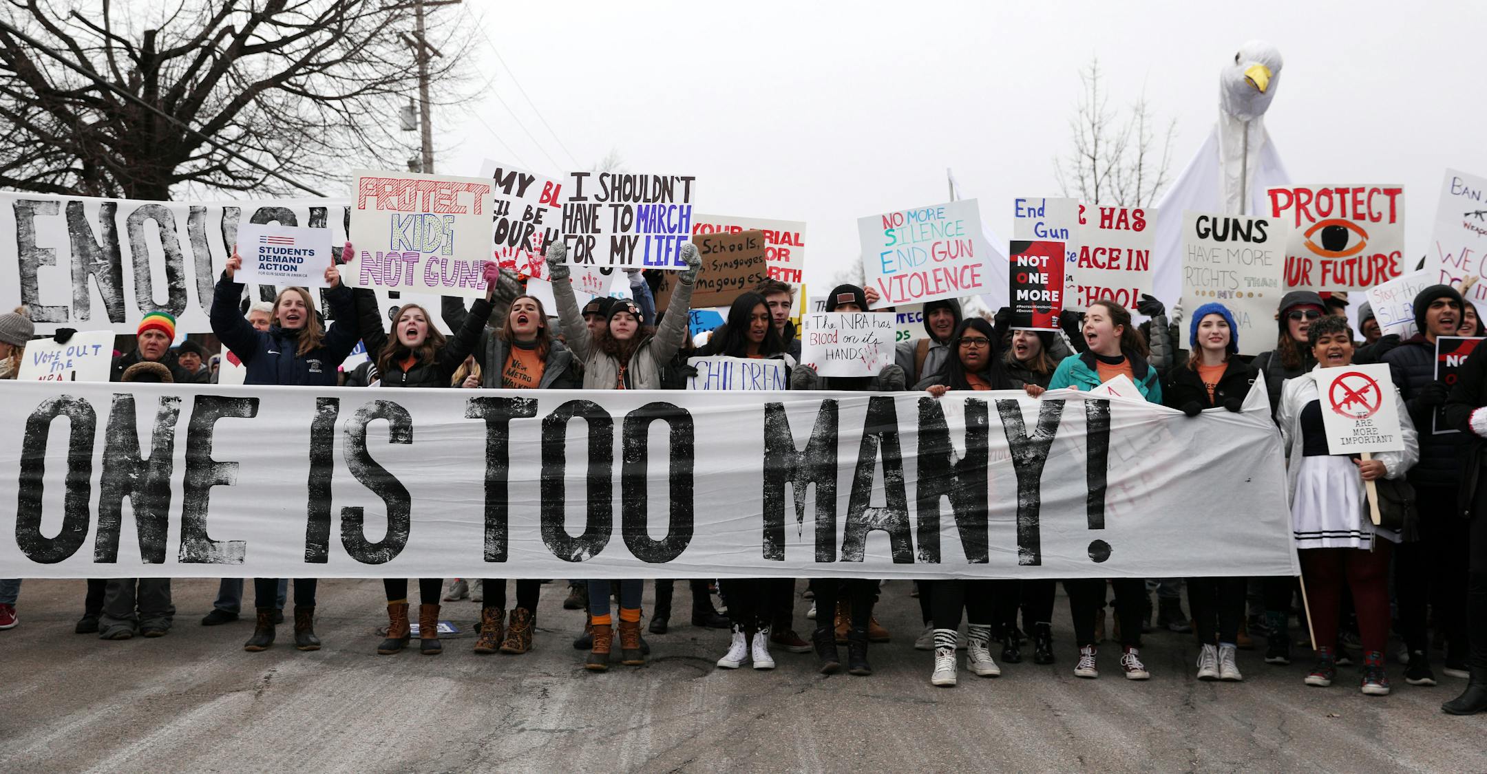Students held signs as they gathered at Harriet Island Regional Park in St. Paul on March 24 before matching to the State Capitol protesting gun violence.