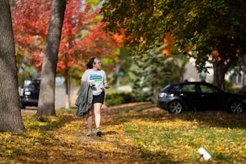 Jenny Barrett, a field director for the Kate Mortenson for City Council campaign, door-knocks in Minneapolis.