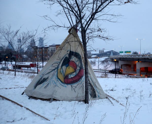 Protesters have erected a teepee at the center of a former homeless encampment in south Minneapolis, seen Saturday morning.