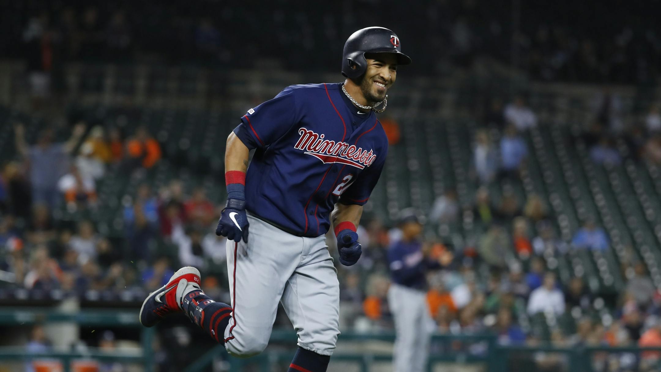 Minnesota Twins' Eddie Rosario smiles as he rounds the bases after hitting a two-run home run in the eighth inning of a baseball game against the Detroit Tigers in Detroit, Wednesday, Sept. 25, 2019.