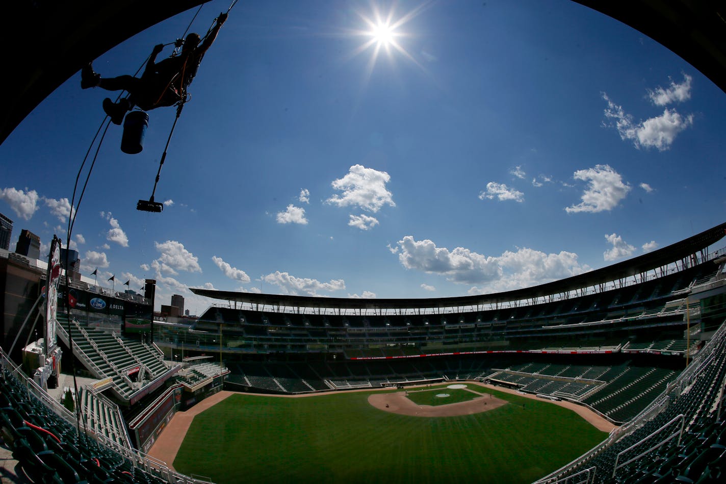 Troy D'Andrea of Prescott, Wisconsin washed the score board in left field at Target Filed during preparation for the 2014 Major League Baseball All Star Game.