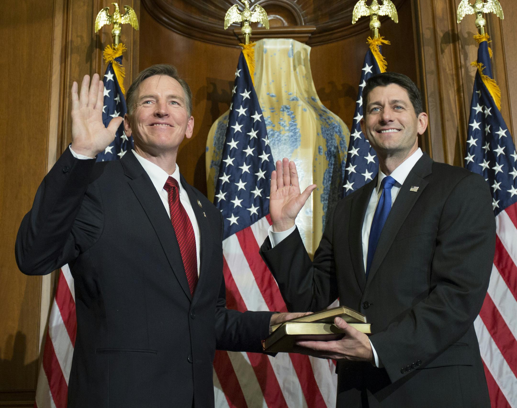 House Speaker Paul Ryan of Wis. administers the House oath of office to Rep. Paul Gosar, R-Ariz., during a mock swearing in ceremony on Capitol Hill in Washington, Tuesday, Jan. 3, 2017. (AP Photo/Zach Gibson)