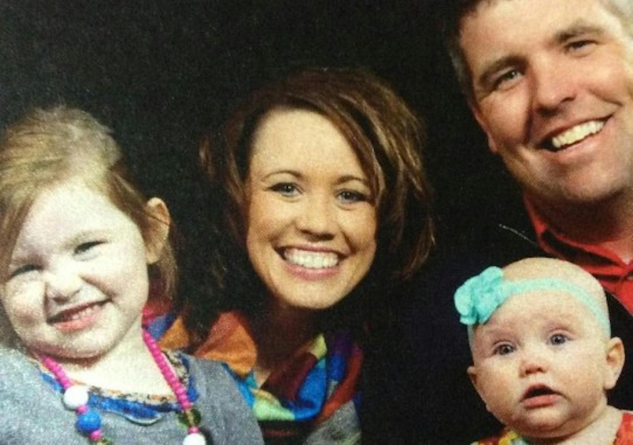 Andrea Boeve was biking with her two little girls, Claire, left, and Mallorie (1), when she was struck from behind by a pickup truck and killed. Her husband Matt is at right.