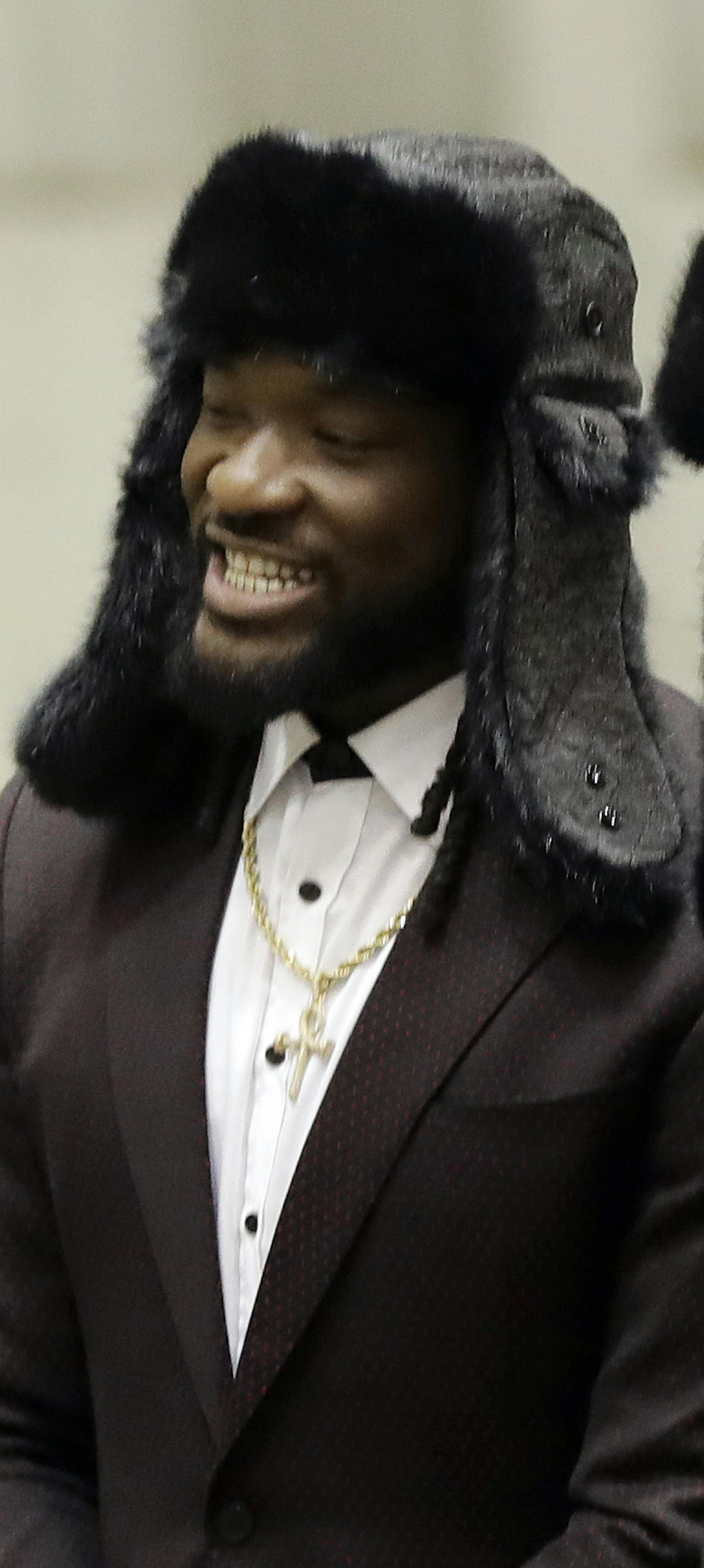 Philadelphia Eagles running back Corey Clement, left, and running back LeGarrette Blount, center, arrive with teammates for the NFL Super Bowl 52 football game Sunday, Jan. 28, 2018, in Minneapolis. Philadelphia a a scheduled to face the New England Patriots. (AP Photo/Eric Gay) ORG XMIT: MNEG112