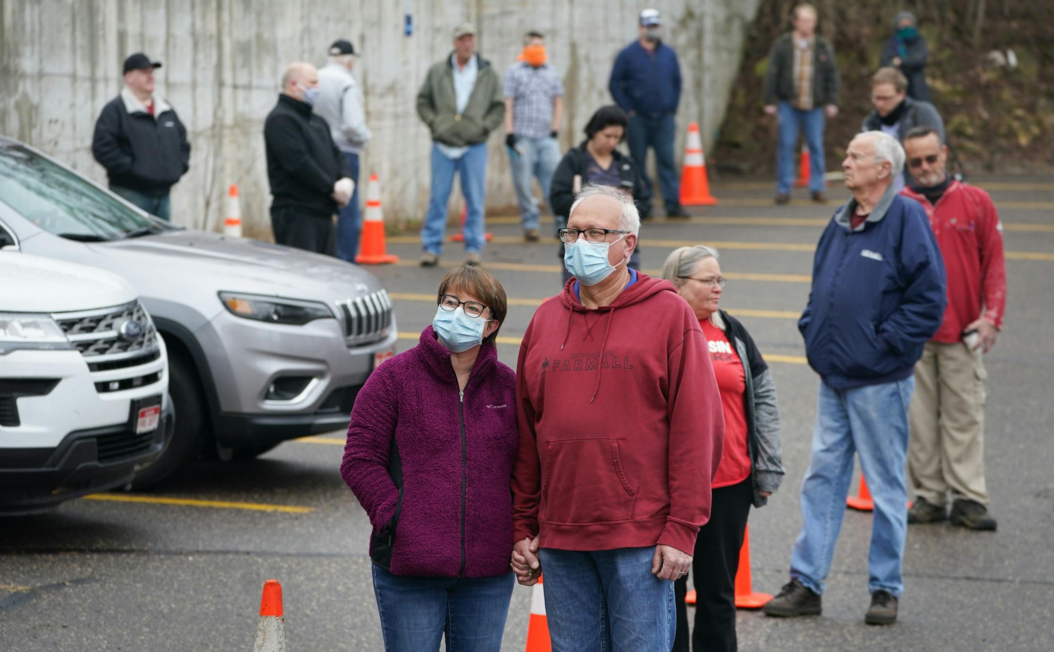 Brenda and Mike Drinken of Hudson, Wisconsin held hands as they waited in line to vote Tuesday morning. Voters in Hudson, Wisconsin were allowed into the firehouse one by one to vote in Tuesday's primary. They lined up next to cones in the parking lot that were ten feet apart. They started at a hand washing station and voting equipment was sanitized after each voter. ] GLEN STUBBE • glen.stubbe@startribune.com Tuesday, April 7, 2020 Wisconsin's primary election goes on on Tuesday, despite