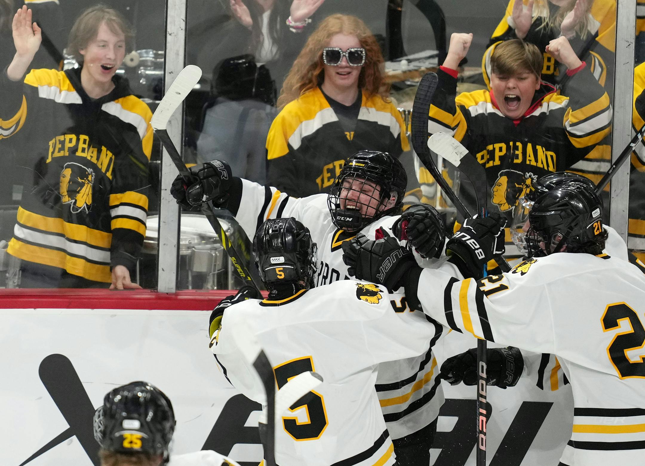 Warroad defenseman Erick Comstock (2) celebrates after scoring the game winning goal past Orono goaltender Brock Peyton (1) in the second period of overtime.