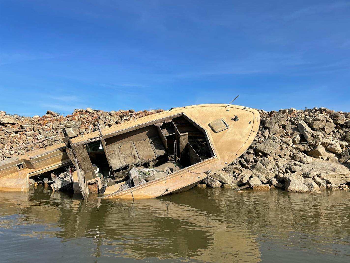 A sunken boat is exposed by low river levels at Cape Girardeau, Mo.