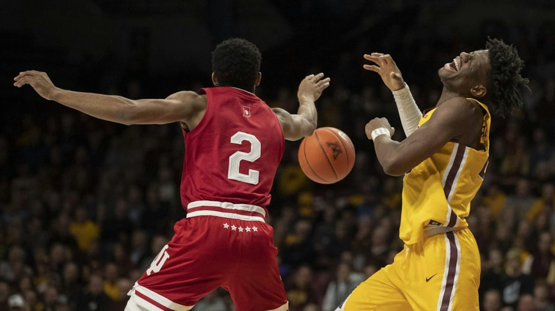 Indiana Hoosiers guard Armaan Franklin (2) knocks the ball away from Minnesota Gophers center Daniel Oturu (25) in the first half.