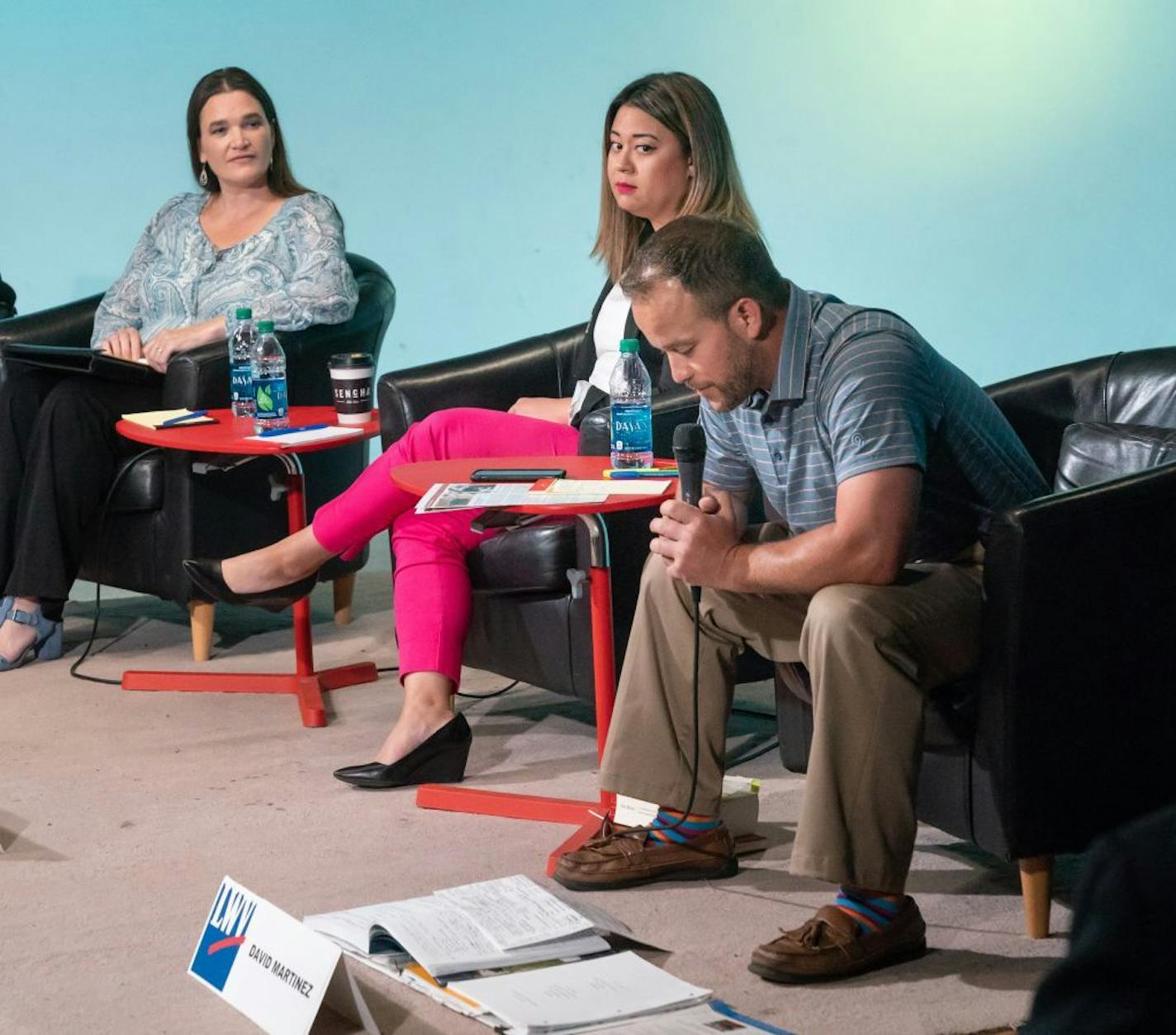 Candidate David Martinez surrounded himself with notes before the St. Paul Ward 4 debate began Monday. Beside him are fellow candidates Shirley Erstad, far left, and Mitra Nelson. The debate was sponsored and moderated by Sarah Risser of the League of Women Voters of St. Paul.